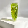 Portable squeeze toy with green liquid and glitter stars, detail close-up view design. - Green