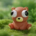 Cute brown bear squeeze toy with big popping eyes, perfect for stress relief and fun desktop. - Pop-out Eyes Bear Two