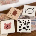 Close-up detail of cute portable folding makeup mirrors with lovely cartoon patterns on table. - Polka Dot Coffee Bear - Mirror