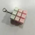 Detailed view of the mechanical keyboard keycap fidget toy keychain with cute pastel colors. - 9 Keys 333 with Light / Pink White