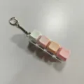 Portable mechanical keyboard switch fidget toy keychain with pastel color keycaps for stress relief. - 4 Keys with Light / Pink White