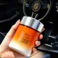 Car aromatherapy diffuser bottle detail view, long-lasting fragrance and vehicle odor removal. - Rose Yellow