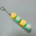 Cute cat paw mechanical keyboard switch tester keychain, silicone decompression toy. - Four-Button Transparent Shell - Silicone Cat Paws (Yellow/Green) Snake Chain - No Light