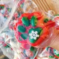 Christmas squishy toy stress relief cute red flower design with snowflake accessory detail. - Large Christmas Cat Paw