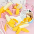 Close up detail of funny peelable banana squeeze stress relief toy, soft novelty fruit model. - Half-Peeled Banana