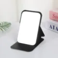 Portable desktop makeup mirror with black PU leather folding stand for daily use. - Mystic Black