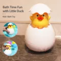 Cute baby bath toy featuring a yellow duck in an eggshell design, perfect for water fun. - Yellow Duck