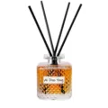 Flacon diffuseur de parfum en verre avec bâtonnets noirs et huile ambrée pour la maison. - Bois d'Oud