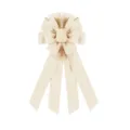 Detail shot of large beige fabric bow, textured ribbon ornament for holiday tree and home decor. - Beige