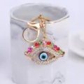Gros plan sur le porte-clés strass mauvais œil brillant, pendentif de voiture en métal. - Couleur 4