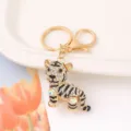 Close-up detail view of the sparkling rhinestone tiger keychain with secure clasp and ring. - Tiger Style 1