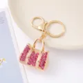 Modieuze strass handtas sleutelhanger, vergulde legering, elegante sprankelende tas hangende. - Roze