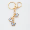 Porte-clés en métal doré avec de charmants papillons bleus pour sacs et voitures. - Papillon 26