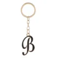 Porte-clés en métal doré avec pendentif lettre B en émail noir, vue détaillée du charm. - Lettre B