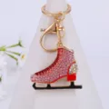 Close-up of sparkling rhinestone ice skate metal keychain detail pendant accessory. - Color 2
