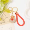 Porte-clés de sac porte-bonheur en strass en forme de cœur avec lanière en cuir rouge. - Couleur 1 avec Corde en Cuir