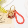 Chinese style cornucopia keychain with rhinestones, metal base, and red braided leather strap. - Color 2 with Leather Strap