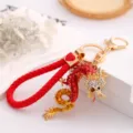 Red dragon keychain with rhinestone and braided leather strap, metal zodiac key ring pendant. - Red + Leather Cord