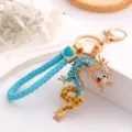 Zodiac dragon metal keychain with blue leather strap and sparkling rhinestones for bags - Lake Blue + Leather Cord