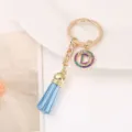 Porte-clés élégant en strass avec pompon bleu anneau en alliage doré charm pour sac - Lettre D