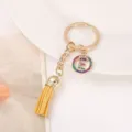 Gold alloy keychain with letter E charm and yellow tassel, stylish bag accessory gift. - Letter E