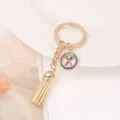 Elegant gold-tone rhinestone letter X tassel keychain stylish bag charm accessory for daily use. - Letter X