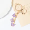 Porte-clés papillon créatif de luxe léger avec strass et anneaux métalliques, cadeau d'anniversaire. - Violet