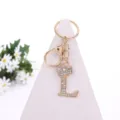 Rhinestone crown letter L keychain detail view, sparkling crystal alloy bag pendant and accessory. - Letter L