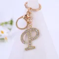 Rhinestone letter P keychain detail closeup, glittering alloy pendant for bags and keys. - Letter P