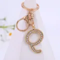 Gold alloy rhinestone letter Q keychain detail view, sparkling crystal pendant charm accessories. - Letter Q