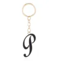 Detail view of a gold-tone keychain featuring a stylish black enamel letter P pendant charm. - Letter P