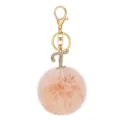Detail view of the pink fluffy pom pom keychain featuring a sparkling rhinestone letter T. - Letter T