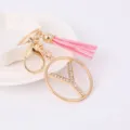 Exquisite gold metal rhinestone letter Y keychain with charming pink leather tassel for bags. - Letter Y