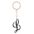 Detailed close-up shot of the fashionable black cursive letter keychain pendant with gold ring. - Letter L
