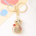 Close-up detail of cute rhinestone cat keychain pendant, sparkling crystal stones and gold metal. - Multi-Color (Color 2)