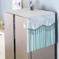 Detailed view of elegant lace refrigerator dust cover with hanging beads, fabric top protector. - Brilliant Blue