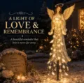 Solar angel garden light detail with glowing snowflake LEDs in snowy night setting - Angel Blessing Light