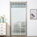 Detail shot of the lace double-layer mesh door curtain with elegant blue valance and tassels. - 90*220cm / Nordic Blue