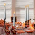 Close-up of white ghost LED candles in a festive Halloween party table setting - Ghost Candle Set / Set of 4