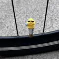 Funny cute little yellow duck bicycle tire valve cap decorative accessory for bike wheels. - Sunglasses Chick