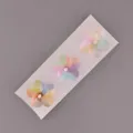 Detailweergave van de schattige kersenbloesem windmolen decoratie voor fietsstuur en frame. - Regenboog driekleur (set van 3)