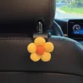 Leuke bloem autostoel hoofdsteun haak, universele achterbank hanger voor tas en portemonnee. - 1 Stuk / Geel