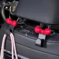 Cute red bow car headrest hook for back seat hanging and auto interior decoration storage. - Black Car Hooks with Red Dopamine Bows (2 Pieces)