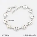 Détail de bracelet lettre U en acier inoxydable, chaîne à charms ronds argentés polis et extension. - Style U