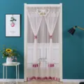 Detailed view of the pink lace door curtain with delicate butterfly decor in a cozy room setting. - Pink Butterfly Curtain with Hook and Loop Tape and Rod
