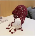 Burgundy crochet flower beanie hat with delicate tassel pendants, handmade hollow knit style. - Burgundy