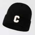 Black knit beanie with bold white and gold letter C patch, cozy warm winter streetwear cap. - Adjustable / Letter C