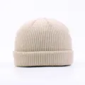 Minimalist beige knitted beanie for men and women, cozy solid color winter warm dock worker cap. - Beige