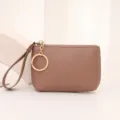 Compact brown coin purse with wrist strap and key ring, minimalist mini wallet for daily use. - Apricot