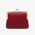 Red leather kiss lock coin purse with metal frame and elegant debossed clover pattern. - Red